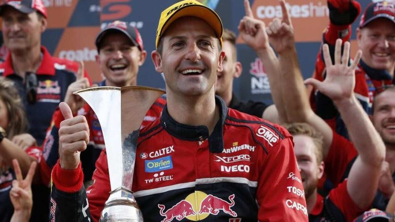 Jamie Whincup with the Supercars Championship trophy