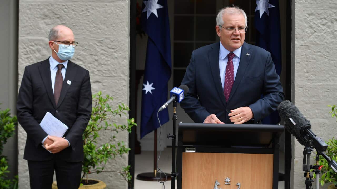 Chief Medical Officer Paul Kelly and Prime Minister Scott Morrison during a press conference at Kirribilli House in Sydney, December 29, 2021.