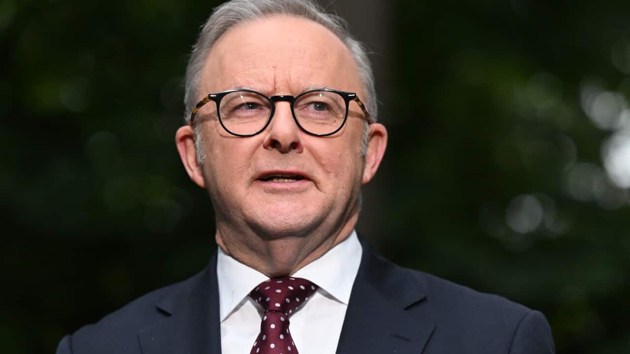 Anthony Albanese speaking while standing outside.