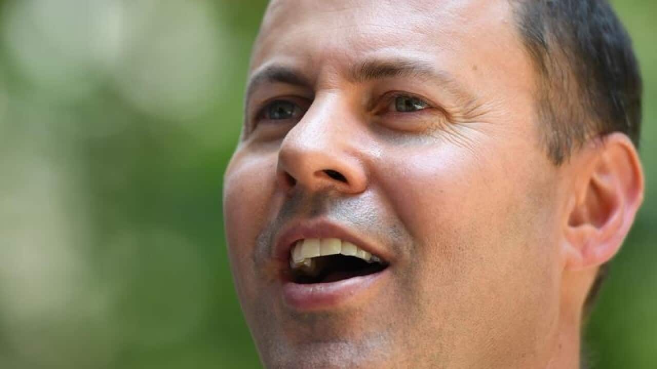 Federal Treasurer Josh Frydenberg speaks to the media in Sydney.