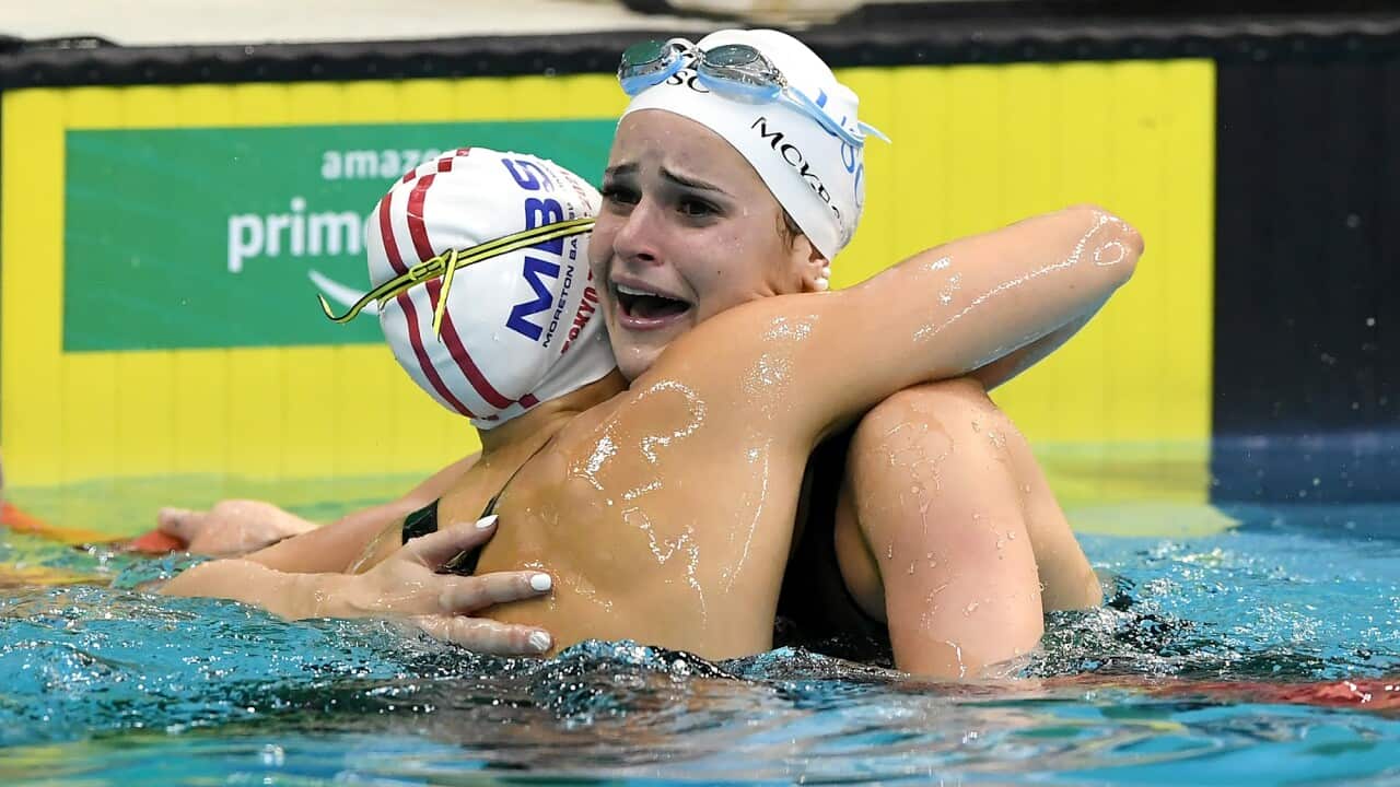 Kaylee McKeown (right) reacts with Minna Atherton after setting a new World Record in the Womens 100m Backstroke Final at the Australian Swimming Trials.