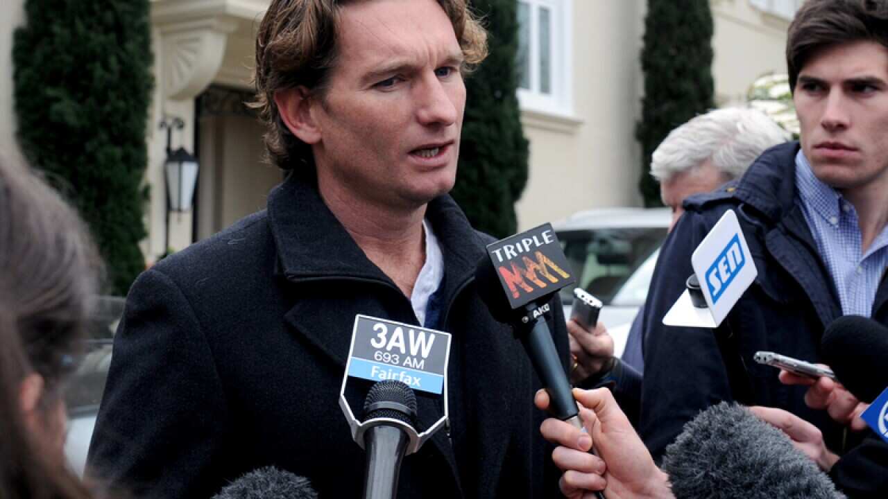 Essendon AFL coach James Hird makes a statement outside his home