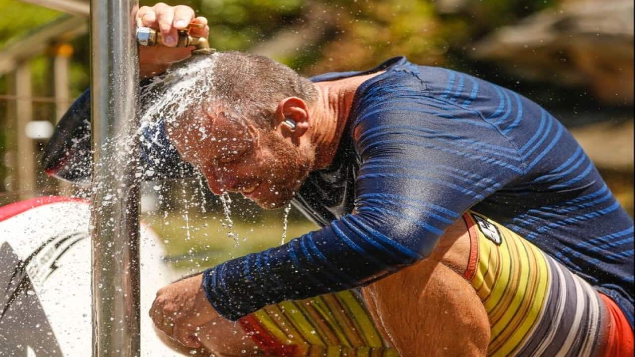 Surfer Brenton Fisher cools off on Tamarama beach
