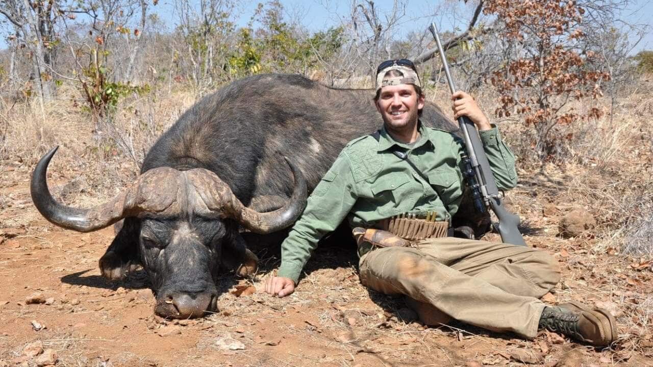 Donald Trump Junior poses next to a kill during a hunting trip to Zimbabwe.