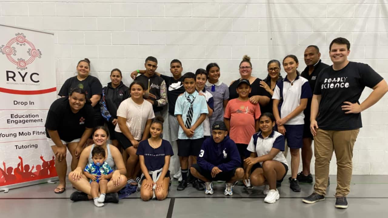 Corey Tutt (R) with the some of the kids and team at Redfern Youth Connect