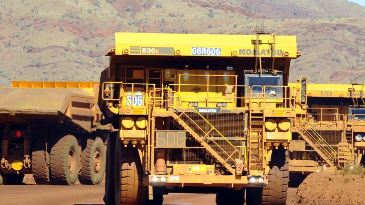 Haulage trucks at the Rio Tinto West Angelas iron ore mine