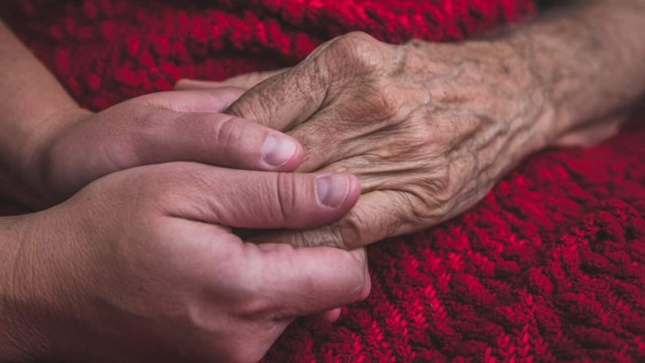 Hospice Nurse visiting an elderly male patient