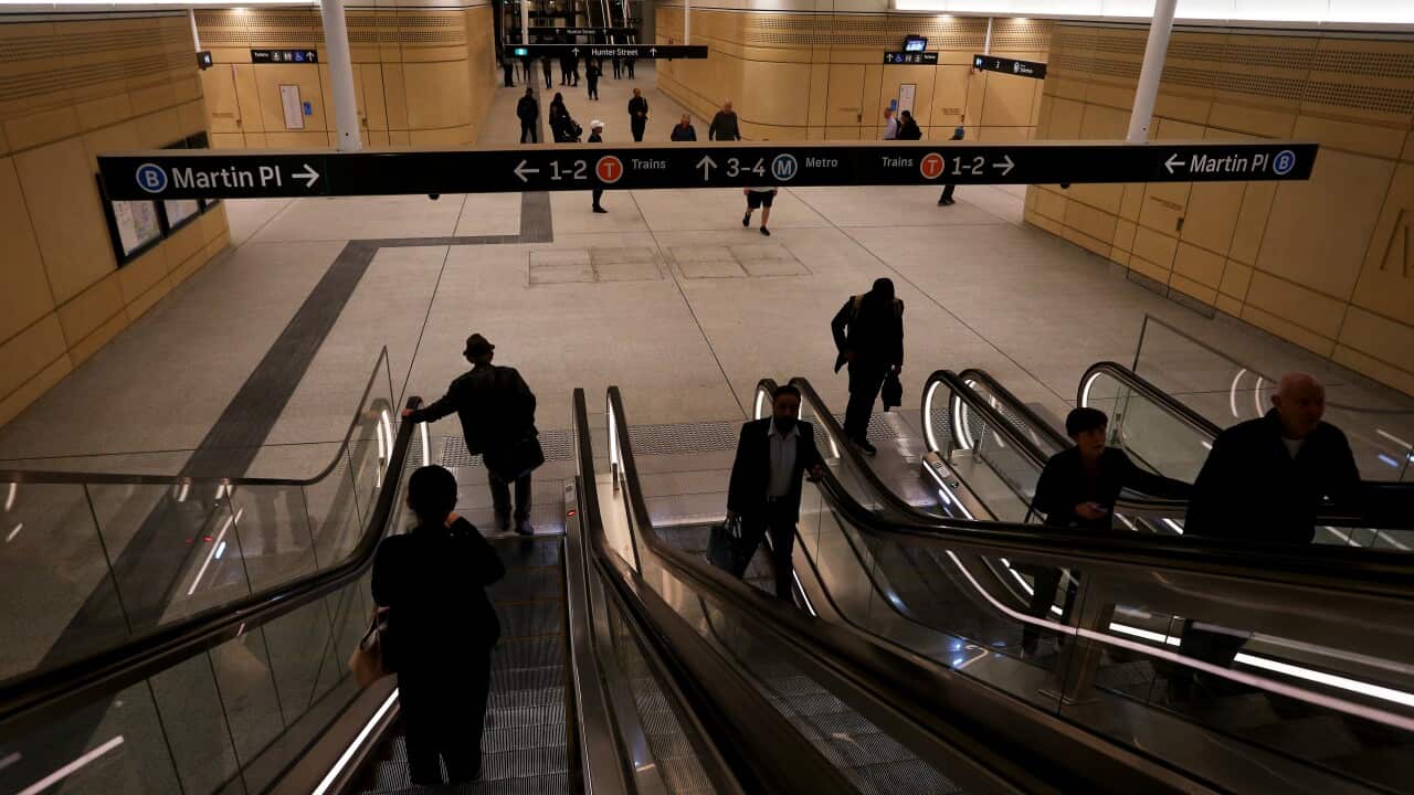 Commuters ride escalators on the new Sydney Metro line.