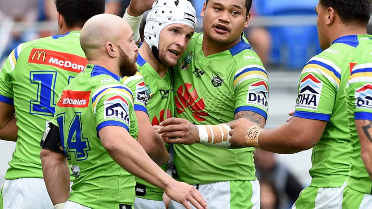 Raiders player Jarrod Croker (centre) celebrates