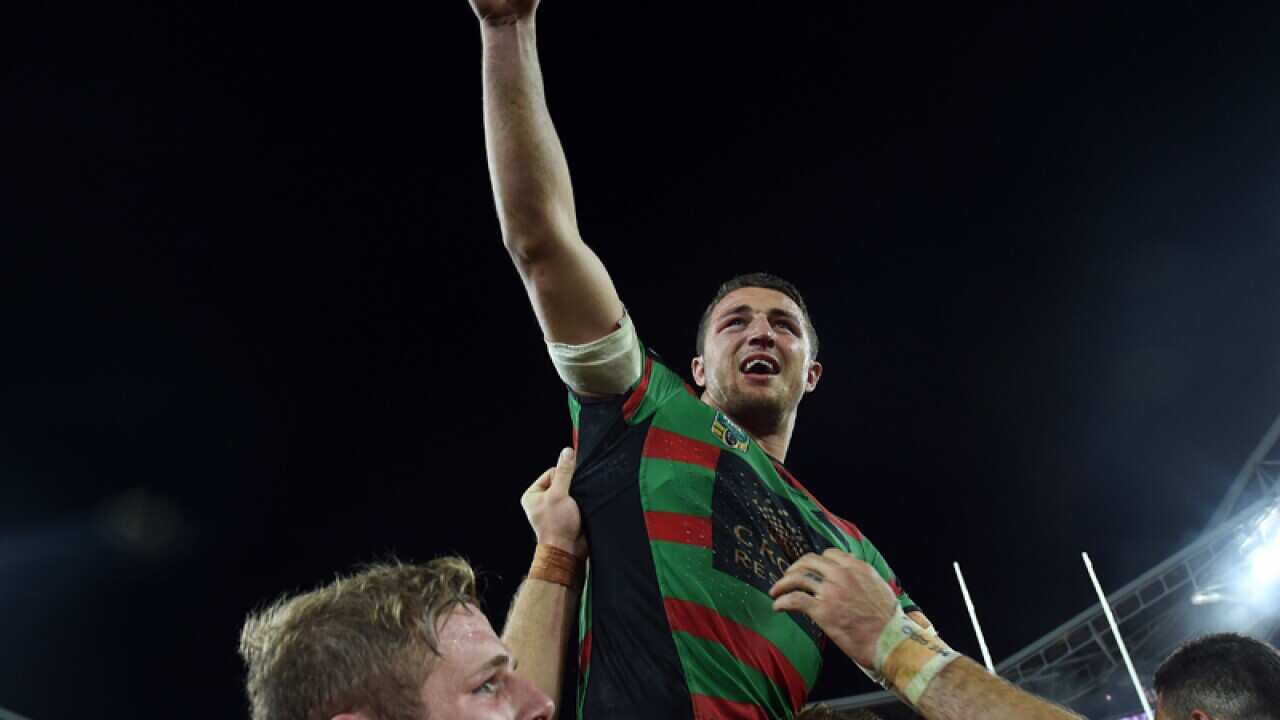 Sam Burgess celebrates the NRL grand final win.