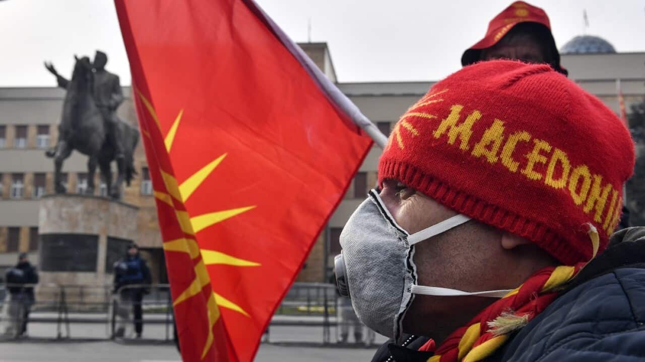 Protestors demonstrate against changing the constitution and the country's name to the Republic of North Macedonia. 