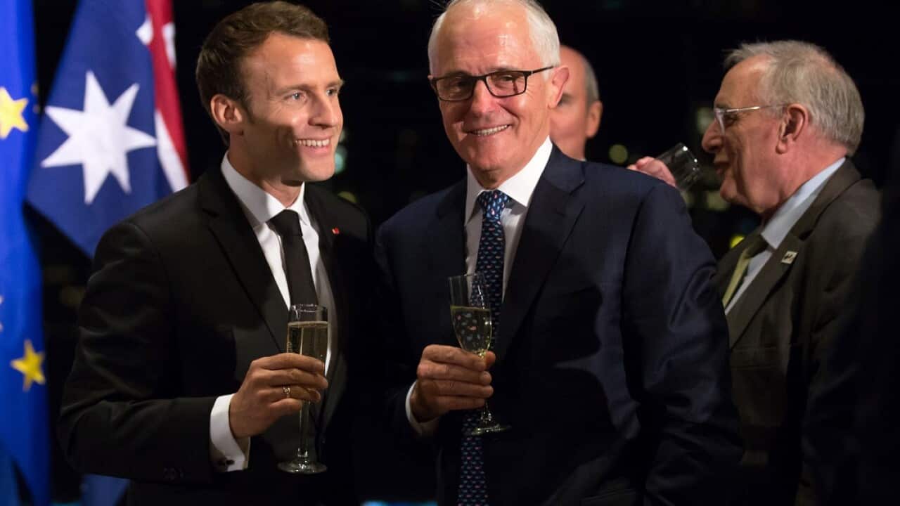 French President and Australia's Prime Minister during a dinner in Sydney.