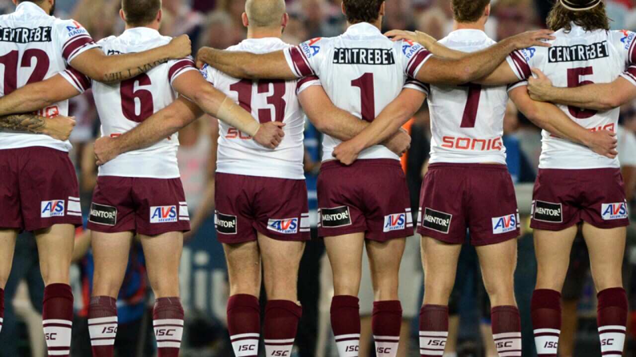 Manly players cross arms before the start of the NRL Grand Final