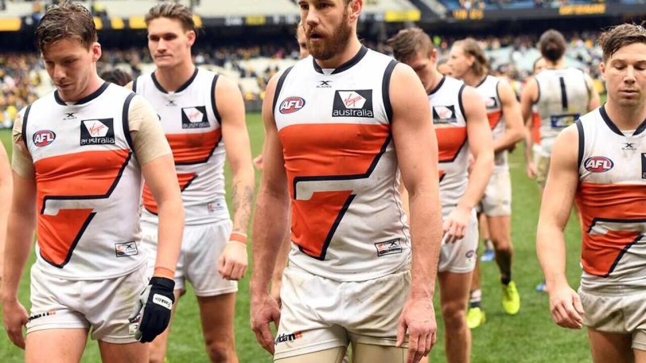 GWS Giants players leave the field