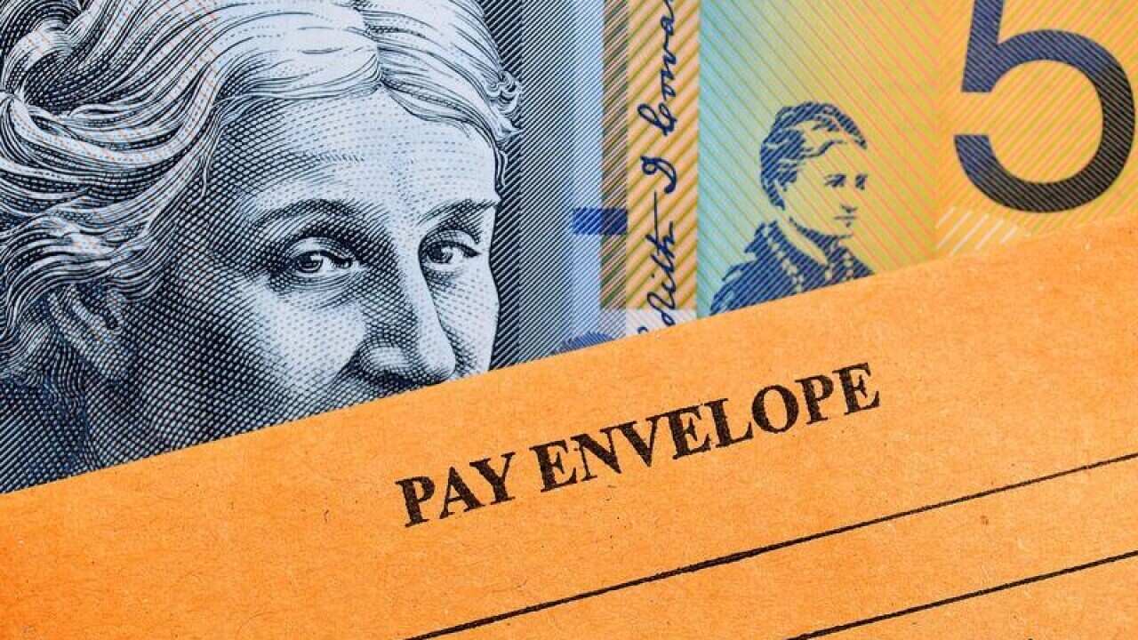 A stock image of Australian currency and a wages envelope.
