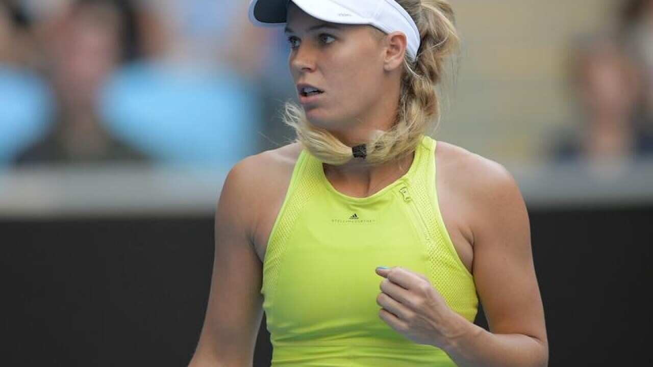 Caroline Wozniacki of Denmark in action against Mihaela Buzarnescu.