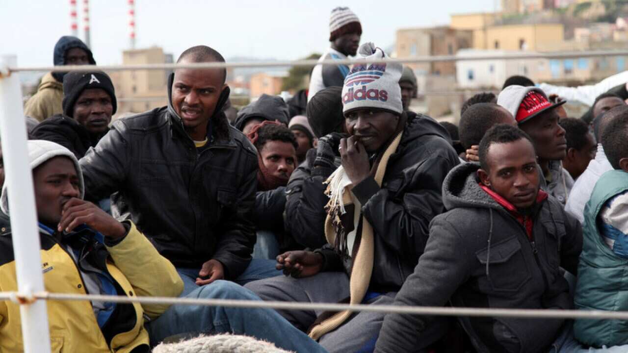 Rescued migrants aboard an Italian coast guard ship