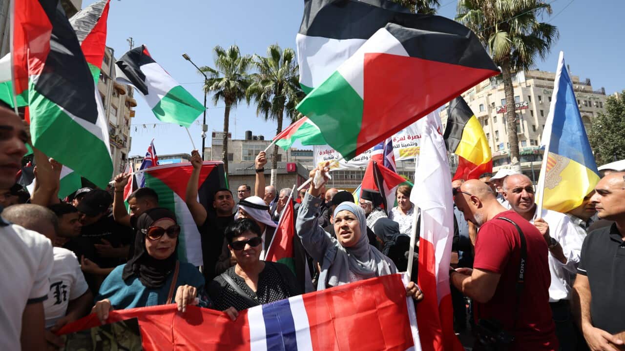 Palestinian demonstrators in the West Bank city of Ramallah celebrate the decision by more countries to recognise a Palestinian state