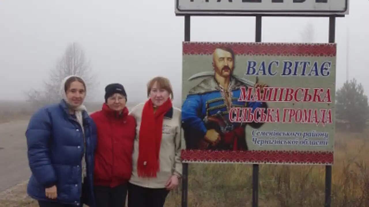 Sonia Mycak (centre) is pictured with her daughter (left) and Ukrainian cousin (right) in their ancestral village of Masheve.