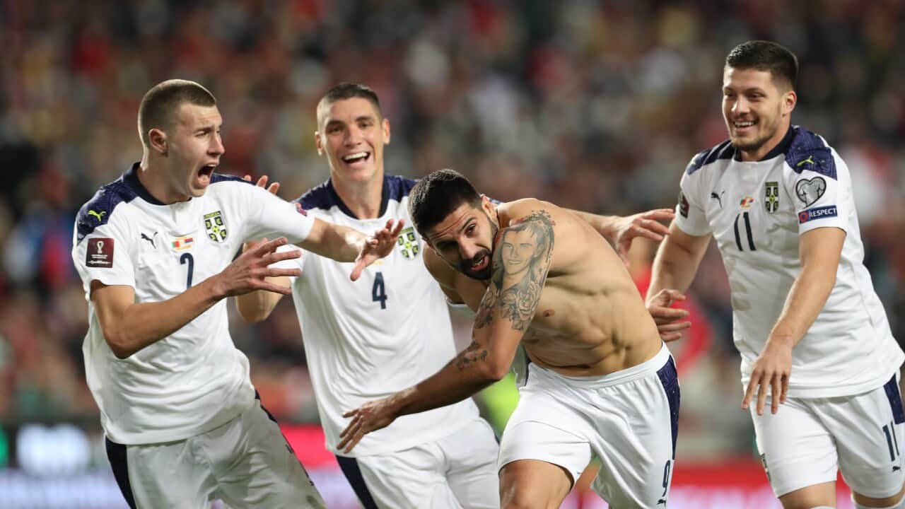 epa09582544 Serbia's player Aleksandar Mitrovic (2R) celebrates after scoring the winning goal against Portugal during the FIFA World Cup 2022 qualifying group A soccer match at Luz Stadium in Lisbon, Portugal, 14 November 2021. EPA/ANTONIO COTRIM