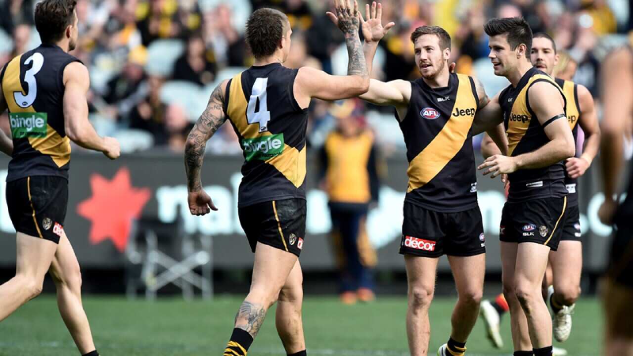 Team-mates congratulate Kane Lambert of the Tigers