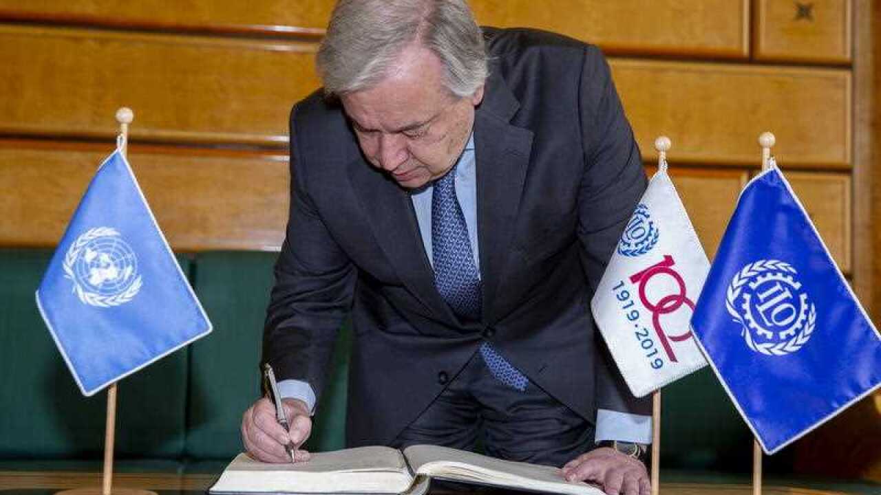 UN Secretary-General Antonio Guterres signs the guest book before the 108th closing session of the International Labour Conference Centenary Session, at the European headquarters of the United Nations in Geneva.