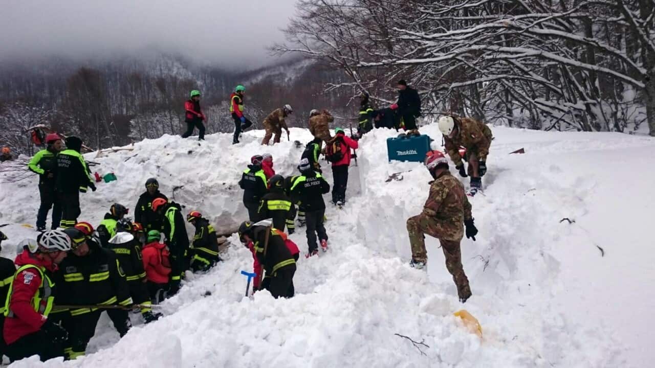 Rescuers work in the area of the hotel that was hit by an avalanche on Wednesday, in Rigopiano, central Italy, Friday, Jan. 20, 2017. 