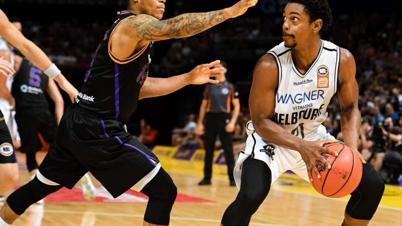 Casper Ware (right) of United competes for possession/