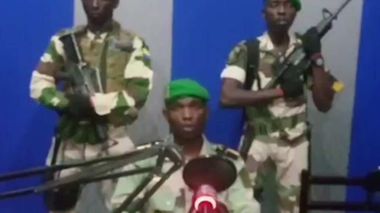 An image off TV of three of the soldiers in the coup bid