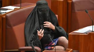 One Nation leader Pauline Hanson wearing a burqa