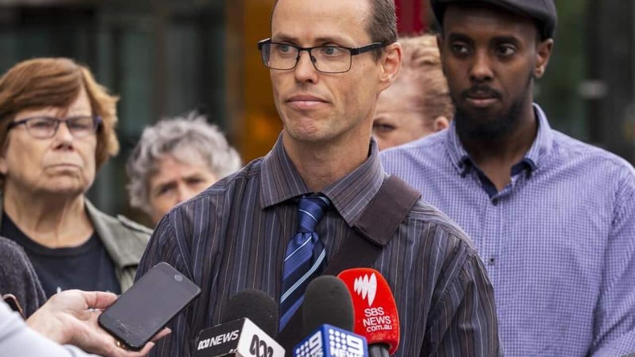 Family friend Brad Coath speaks to the media outside the Federal Court