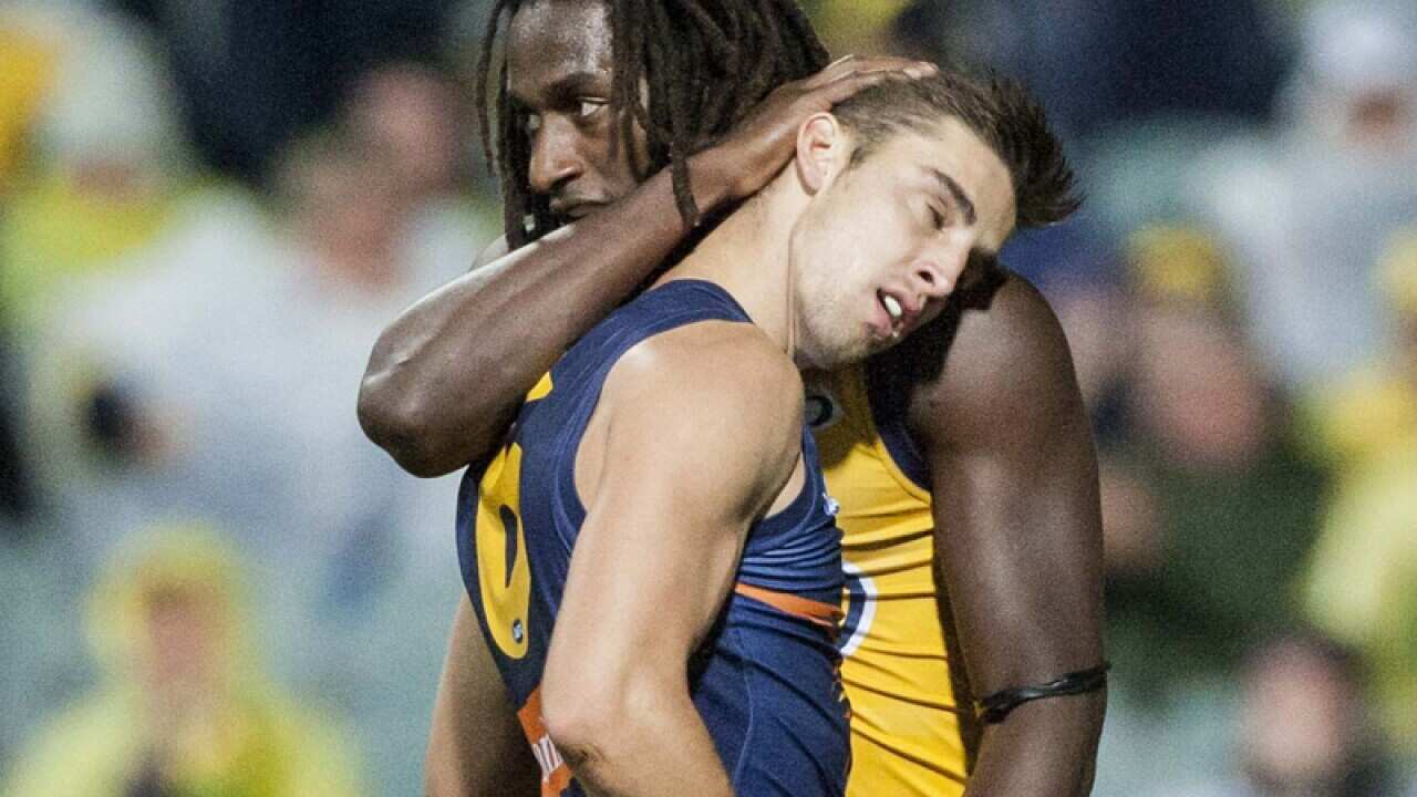 Elliot Yeo of the Eagles is congratulated on a goal by Nic Naitanui