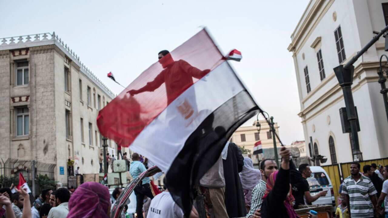 Egyptians celebrate the victory of the Muslim Brotherhood in Cairo. (Getty images)
