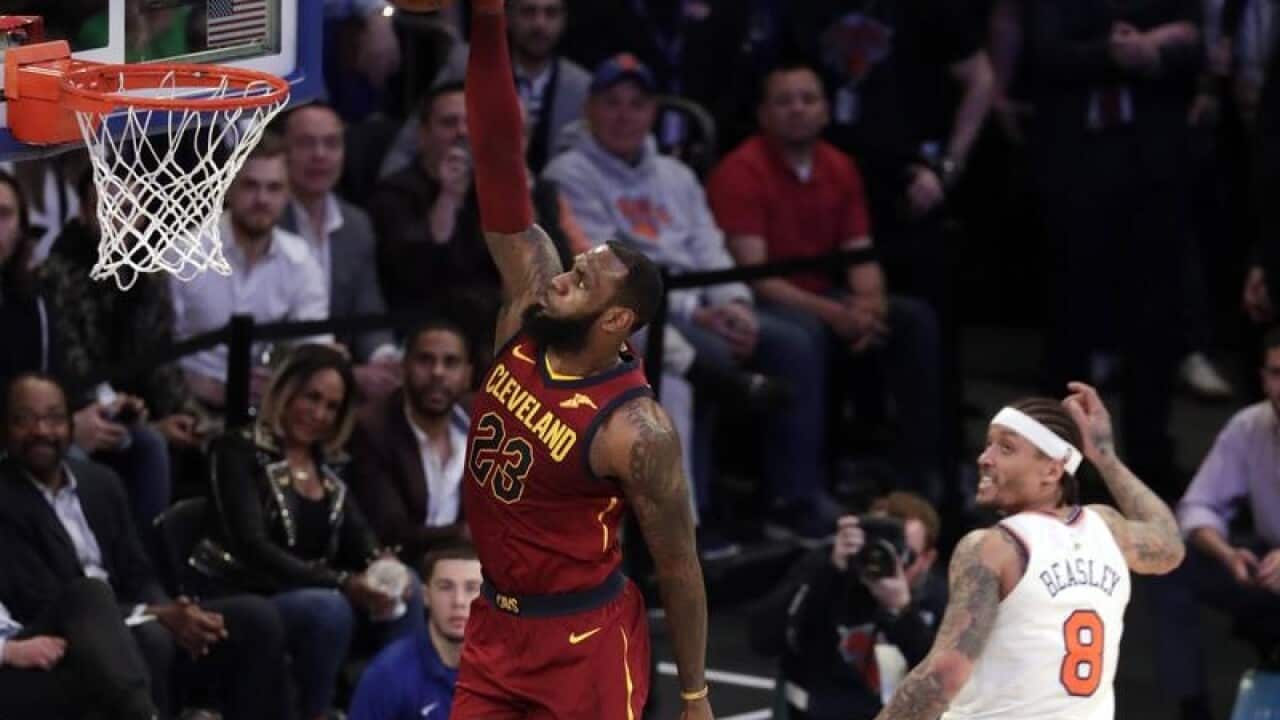 Cleveland Cavaliers forward LeBron James dunks the ball.