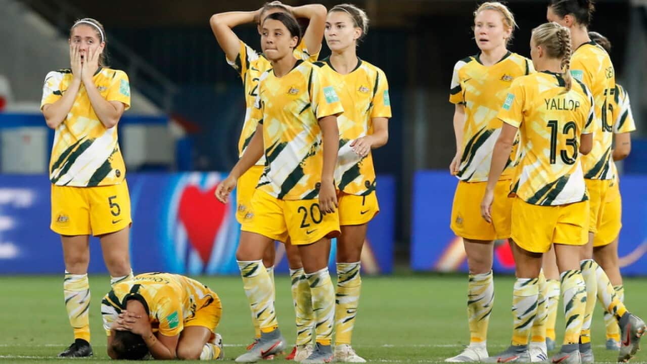 Disppointed Australian players reacting to loss to Norway