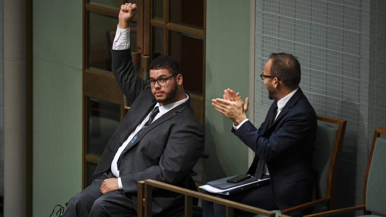 Jordon Steele-John celebrates the passing of the Disability Royal Commission motion in 2019.