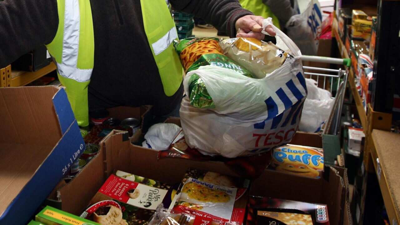 Workers at the Black Country Food Bank prepare food parcels