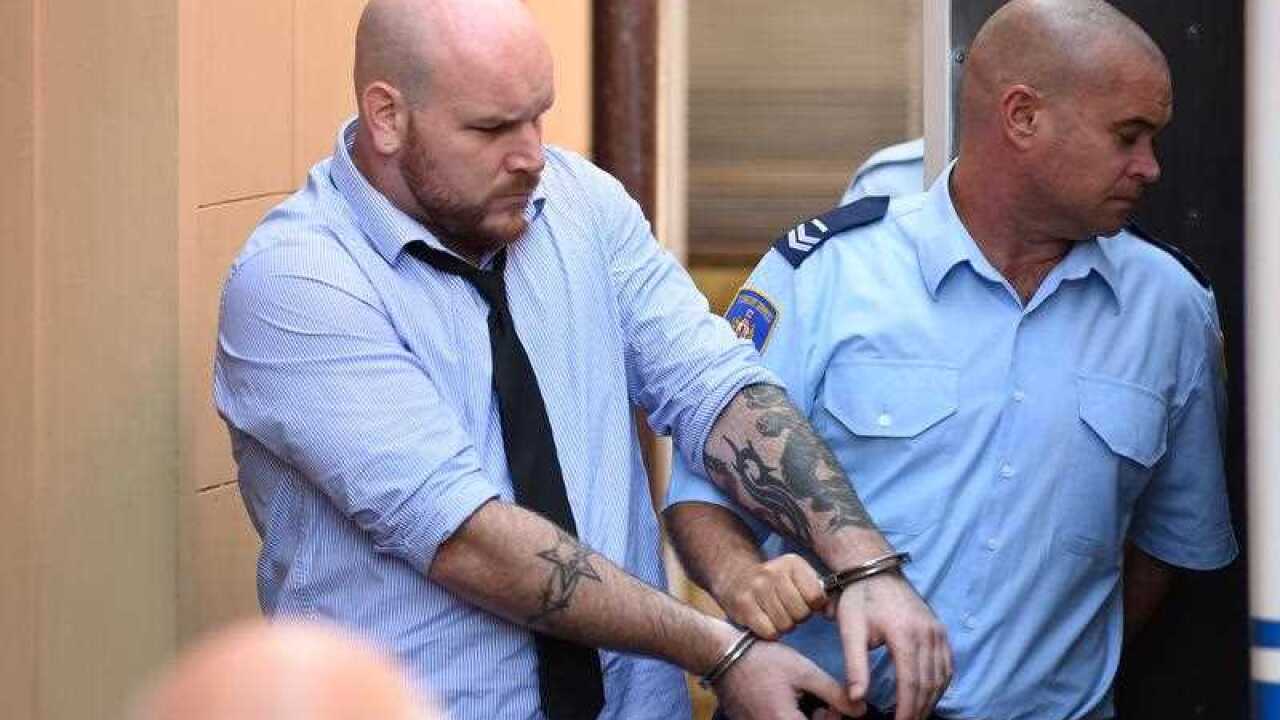 Corey Breen (left) is led to a prison transport vehicle at the Supreme Court of New South Wales following his sentancing.