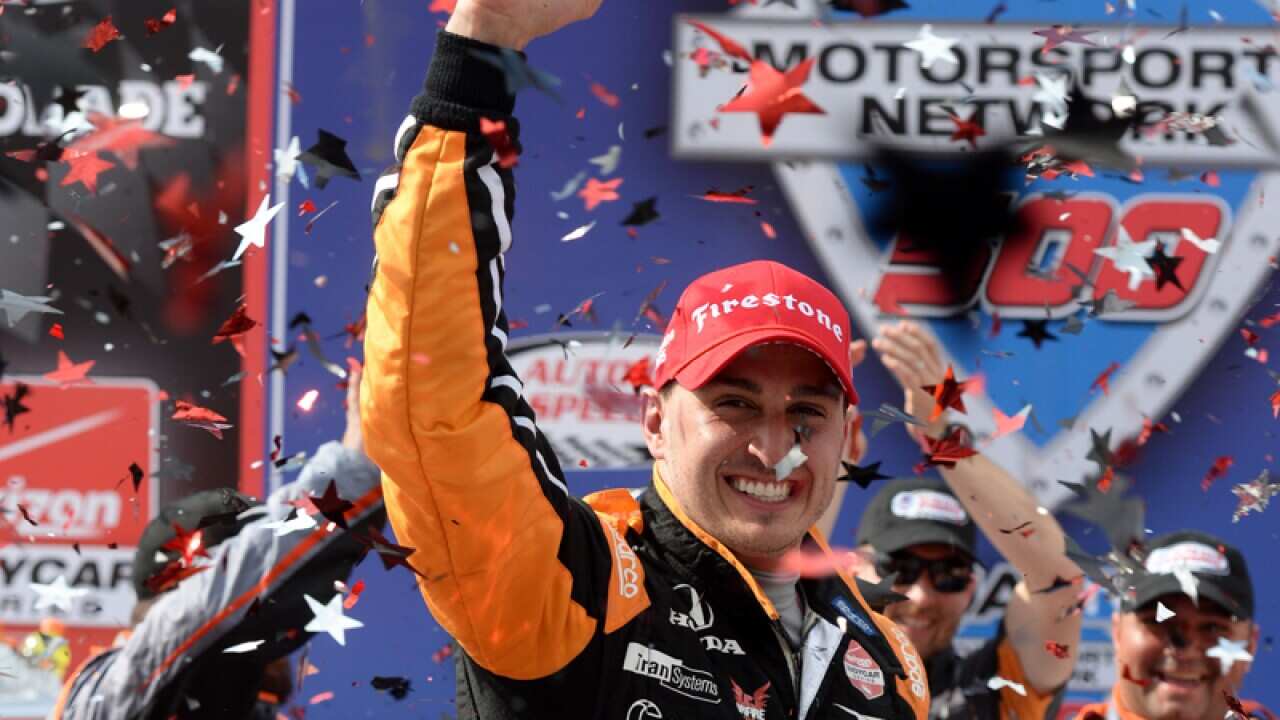 Graham Rahal (15) celebrates after winning the IndyCar auto race