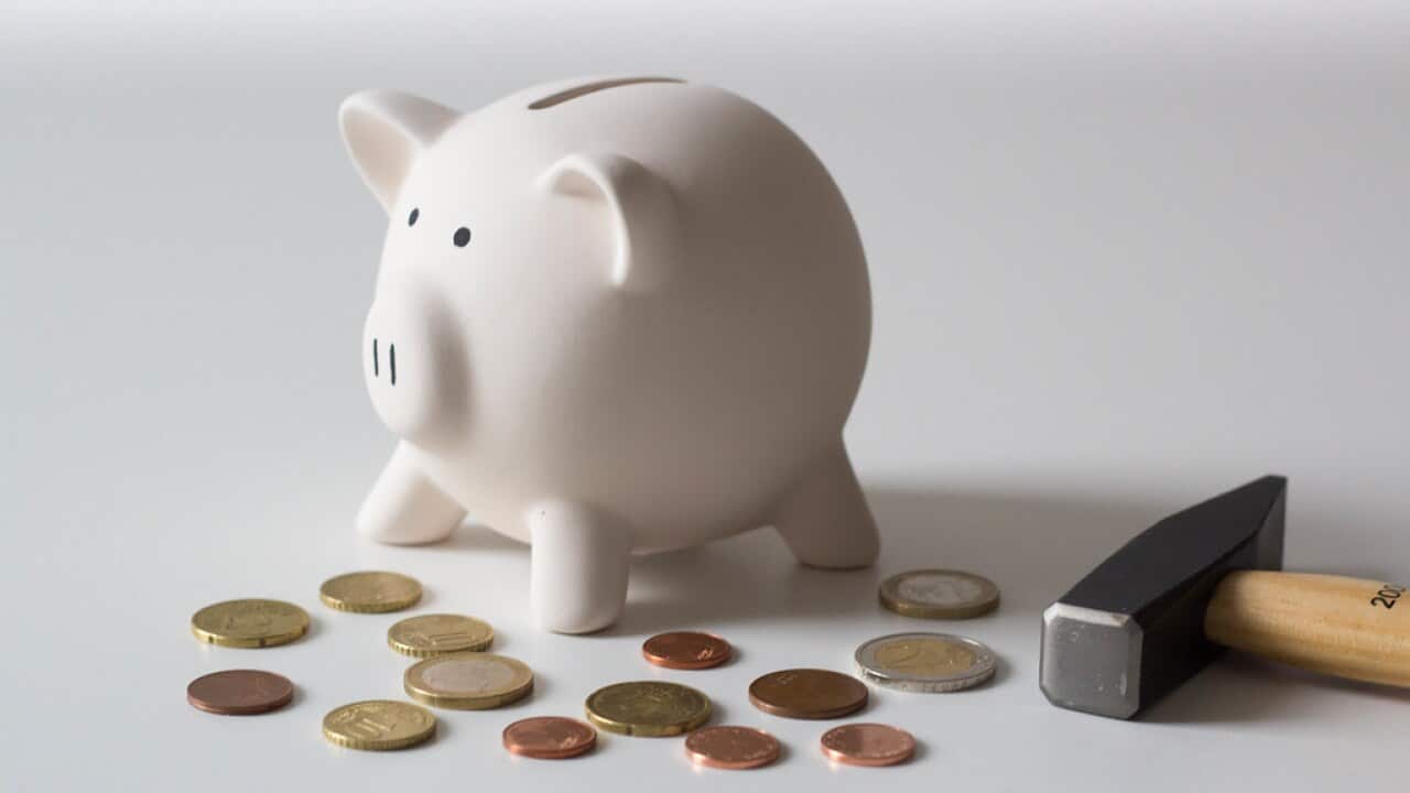 "Piggy bank with hammer" by marcoverch is licensed under CC BY 2.0