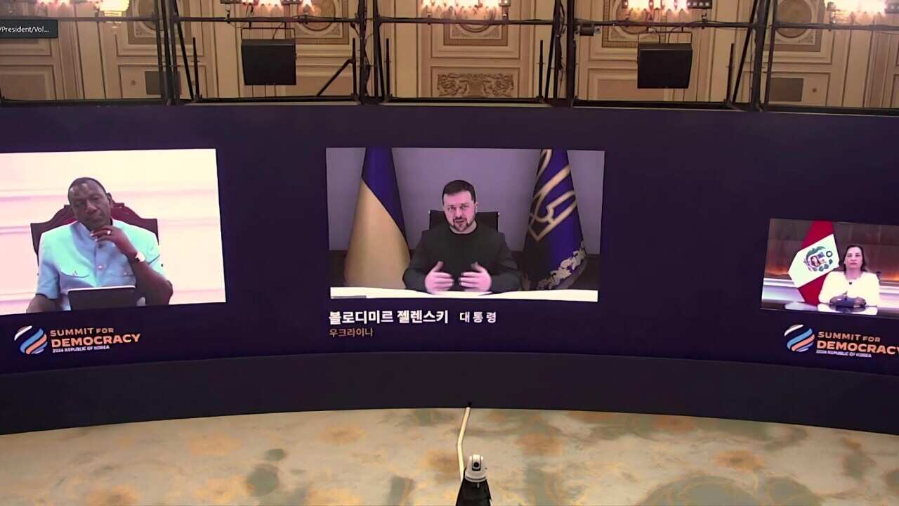 Volodymyr Zelenskyy speaking at the Summit via videolink (AP).