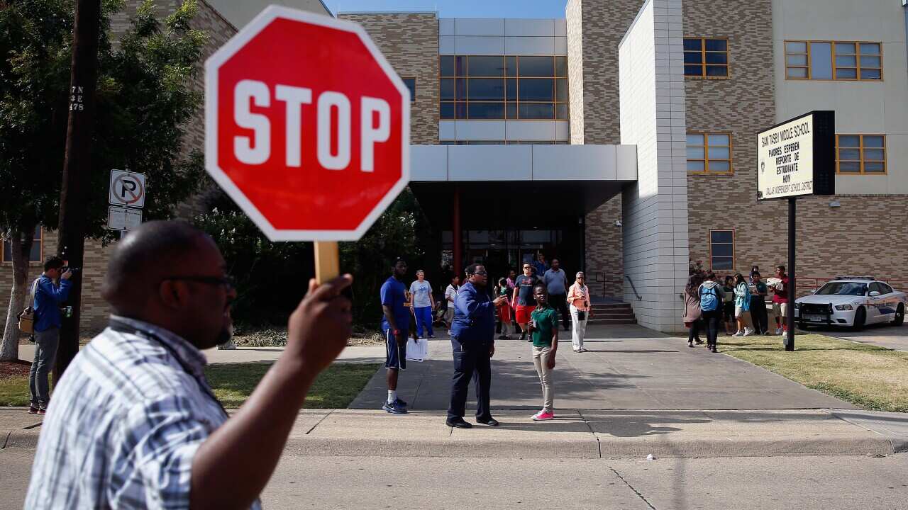 Students are dismissed from Sam Tasby Middle School in Dallas, Texas. Officials confirmed that a student, who had contact with the first confirmed Ebola virus patient in the United States, attends classes at the school. State and local officials are worki