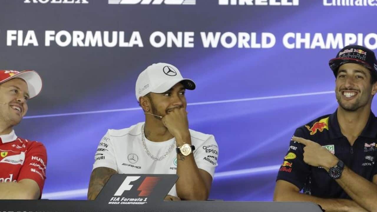 Daniel Ricciardo, right, with Vettel and Hamilton.