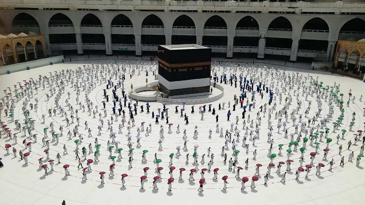 Hundreds of Muslim pilgrims circumambulate around the Kaaba, the cubic building at the Grand Mosque, as they keep social destination to protect themselves.