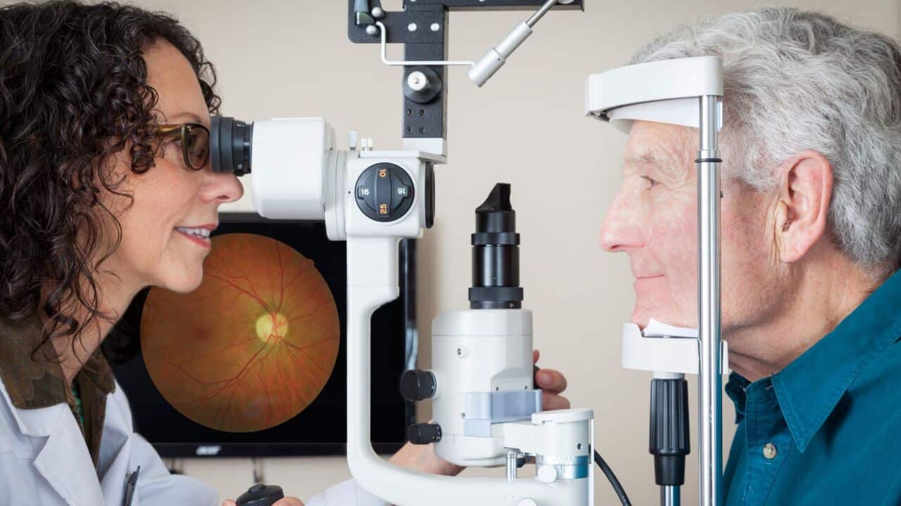 An elderly man getting his eyes checked