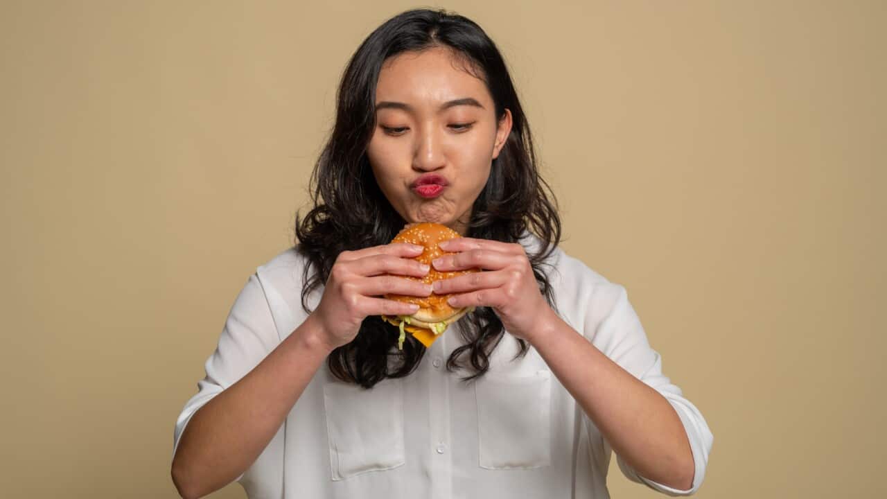 Woman eating a burger