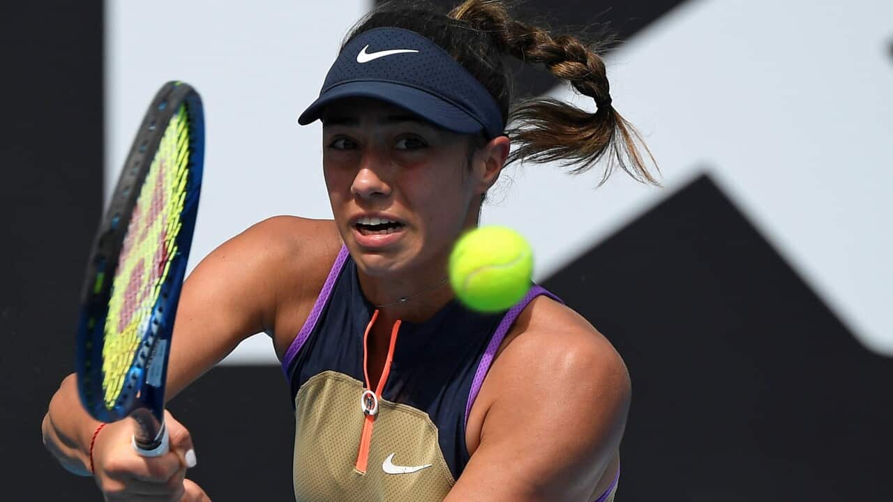 Serbia's Olga Danilovic makes a backhand return to United States' Shelby Rogers during their second round match at the Australian Open tennis championship in Melbourne, Australia, Thursday, Feb. 11, 2021.(AP Photo/Andy Brownbill)