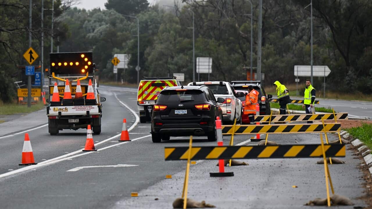 A road closure is seen between the town of Hall and Murrumbateman, Friday, April 7, 2023.