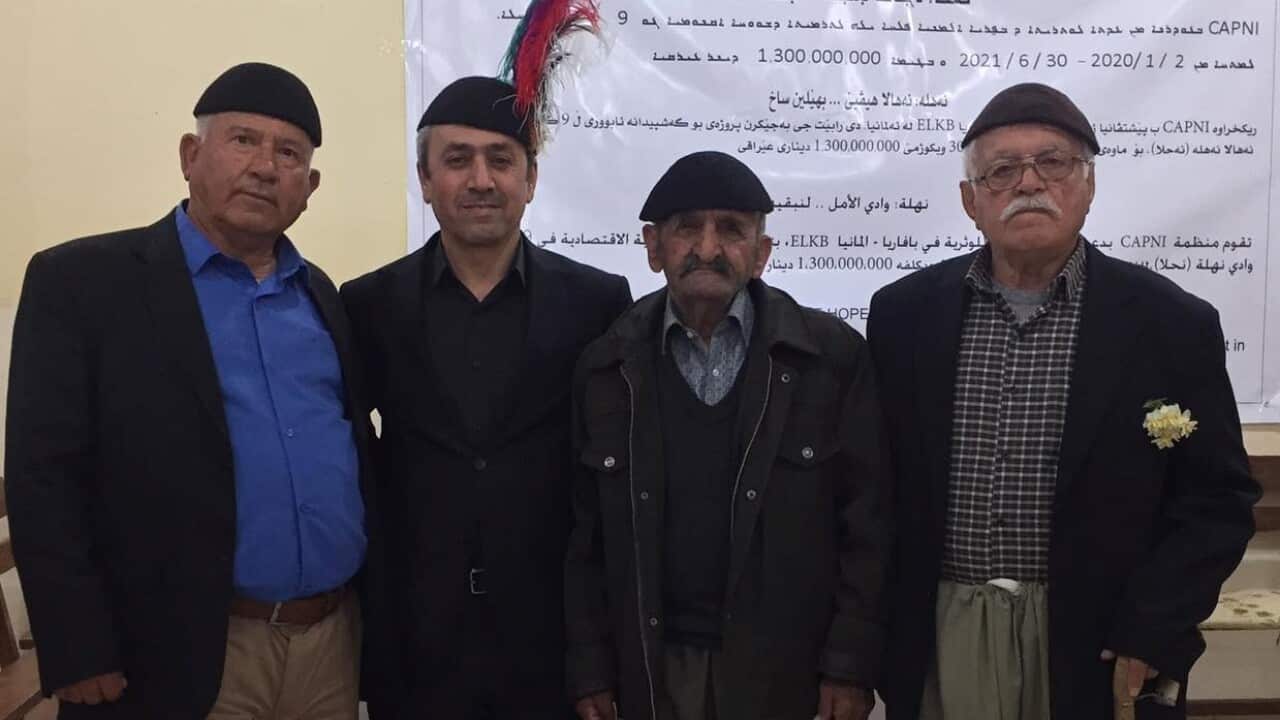 Mikhael Benjamin with Assyrian people in traditional clothes