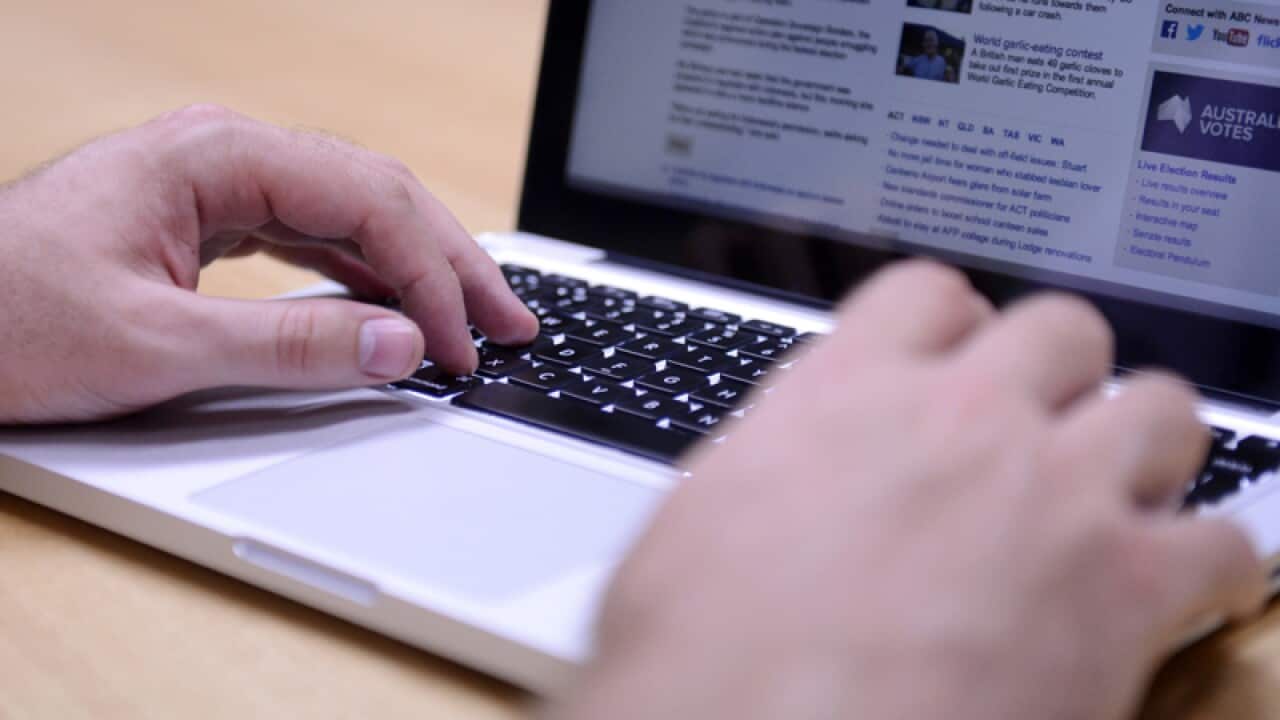 A person uses a laptop computer
